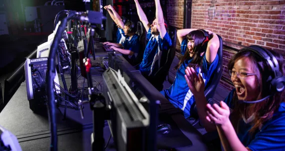 row of participants playing esports