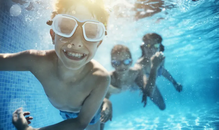 children swimming underwater