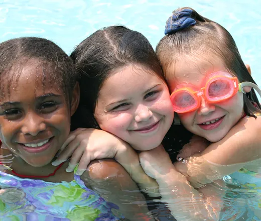 3 happy girls swimming
