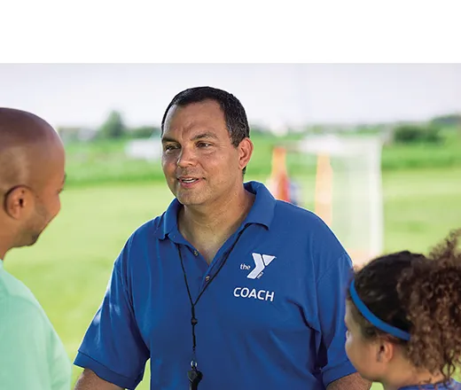 Y coach talking to a parent